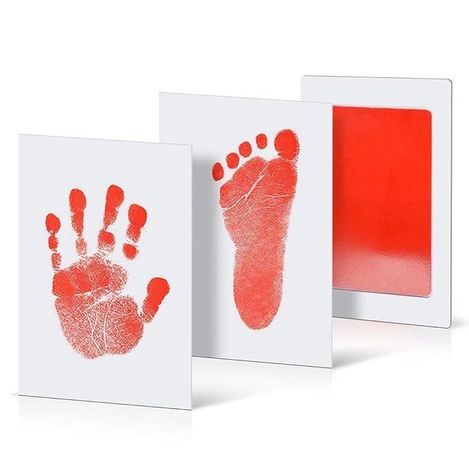 Red hand and footprints on white cards with a red ink pad.